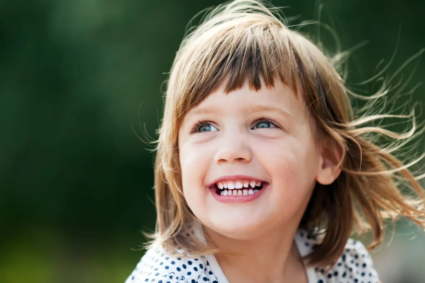 Smiling young girl outdoors